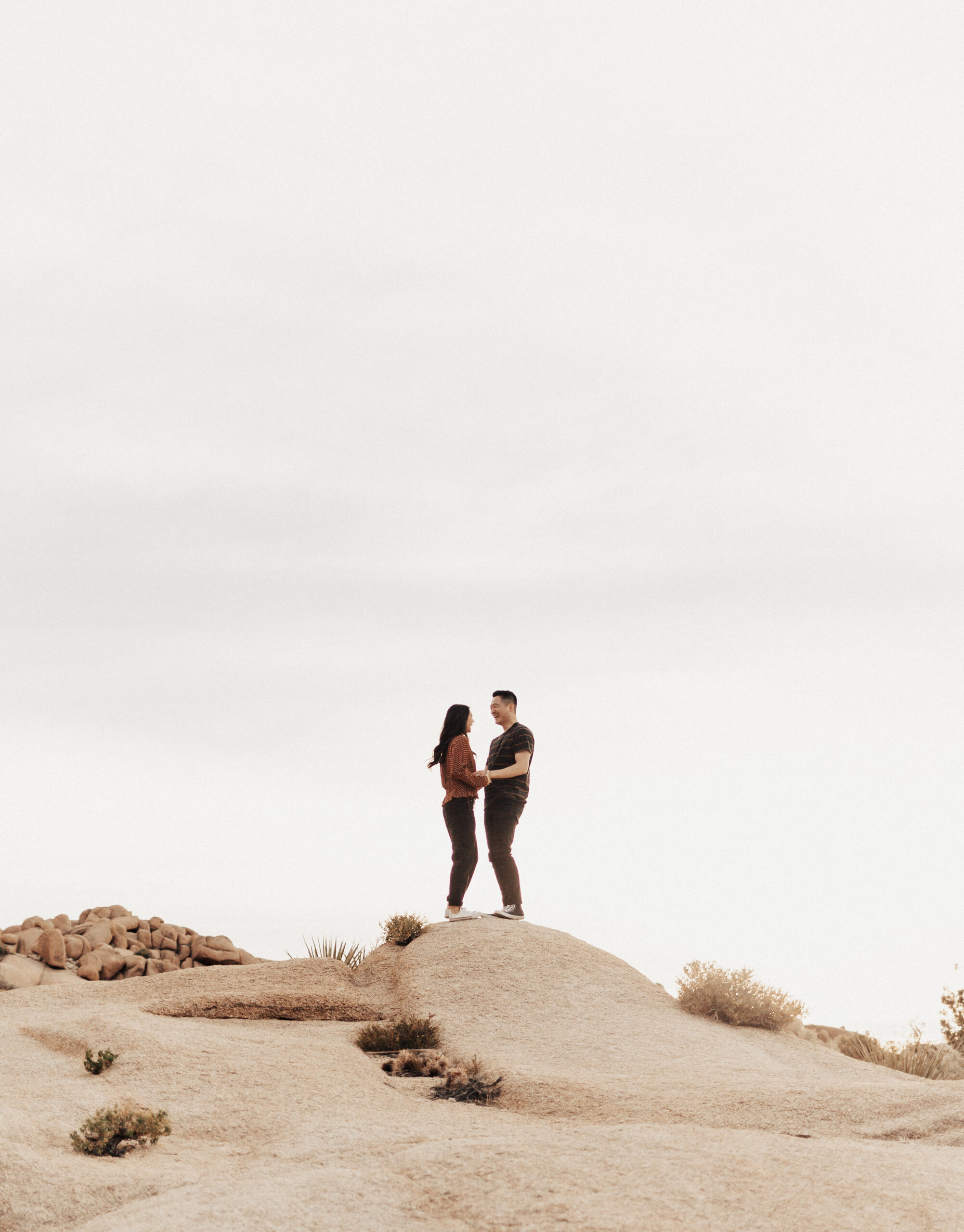 Engaged Couple Far on Rocks