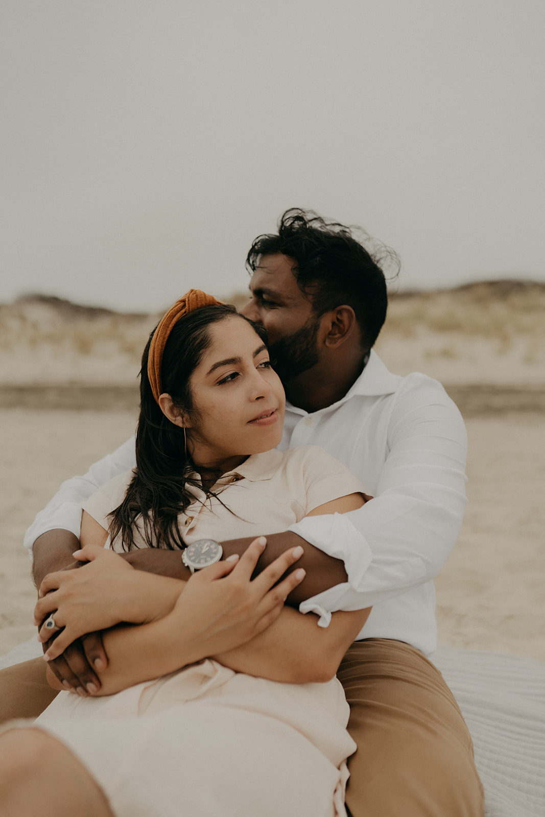 engagement shoot with couple walking on beach
