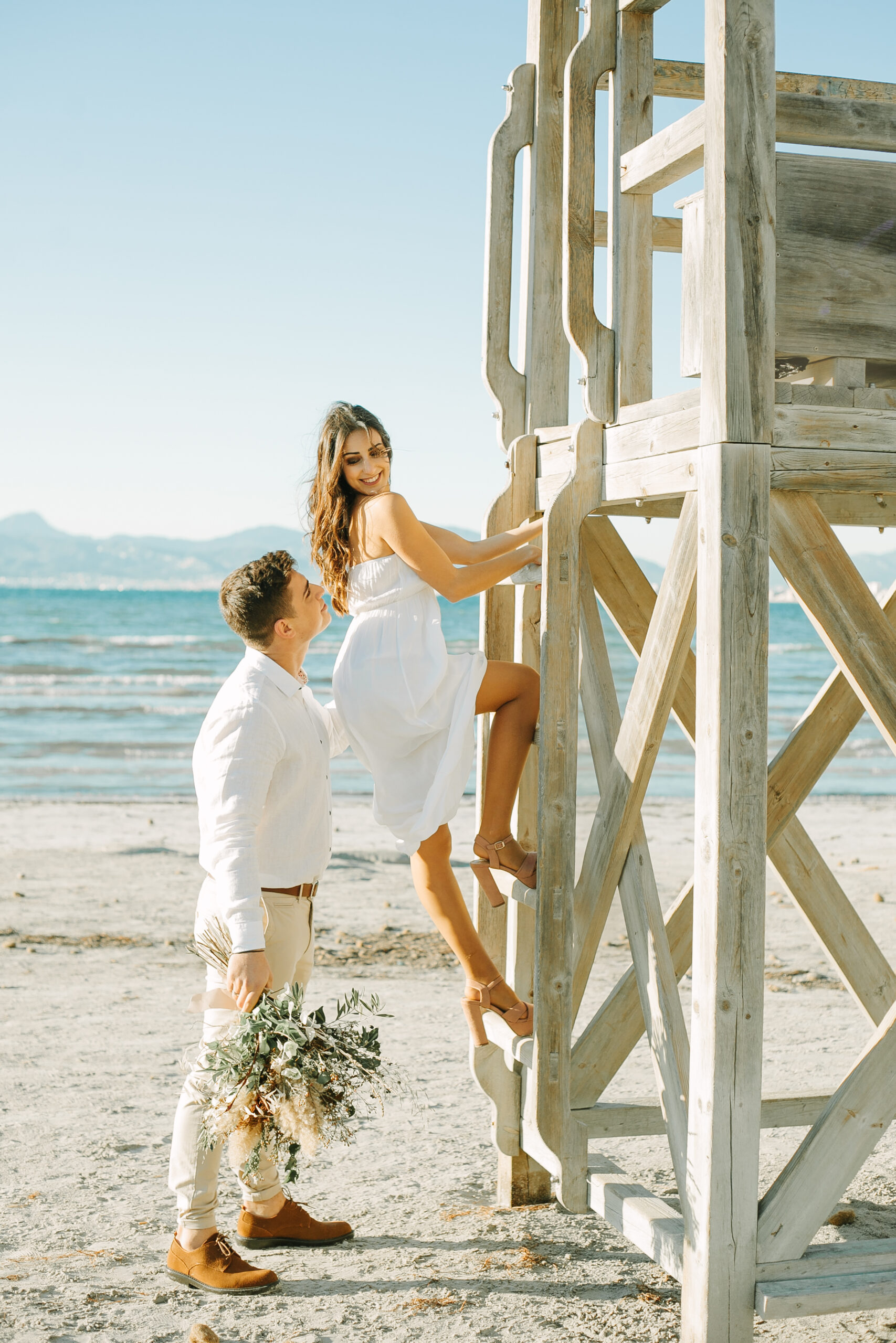 Couple Beach Bride Climbing Tower
