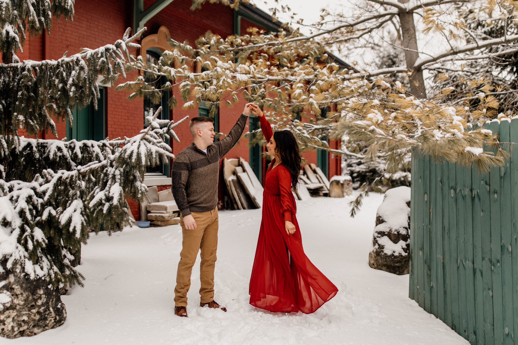 Engaged Couple Snow Dance