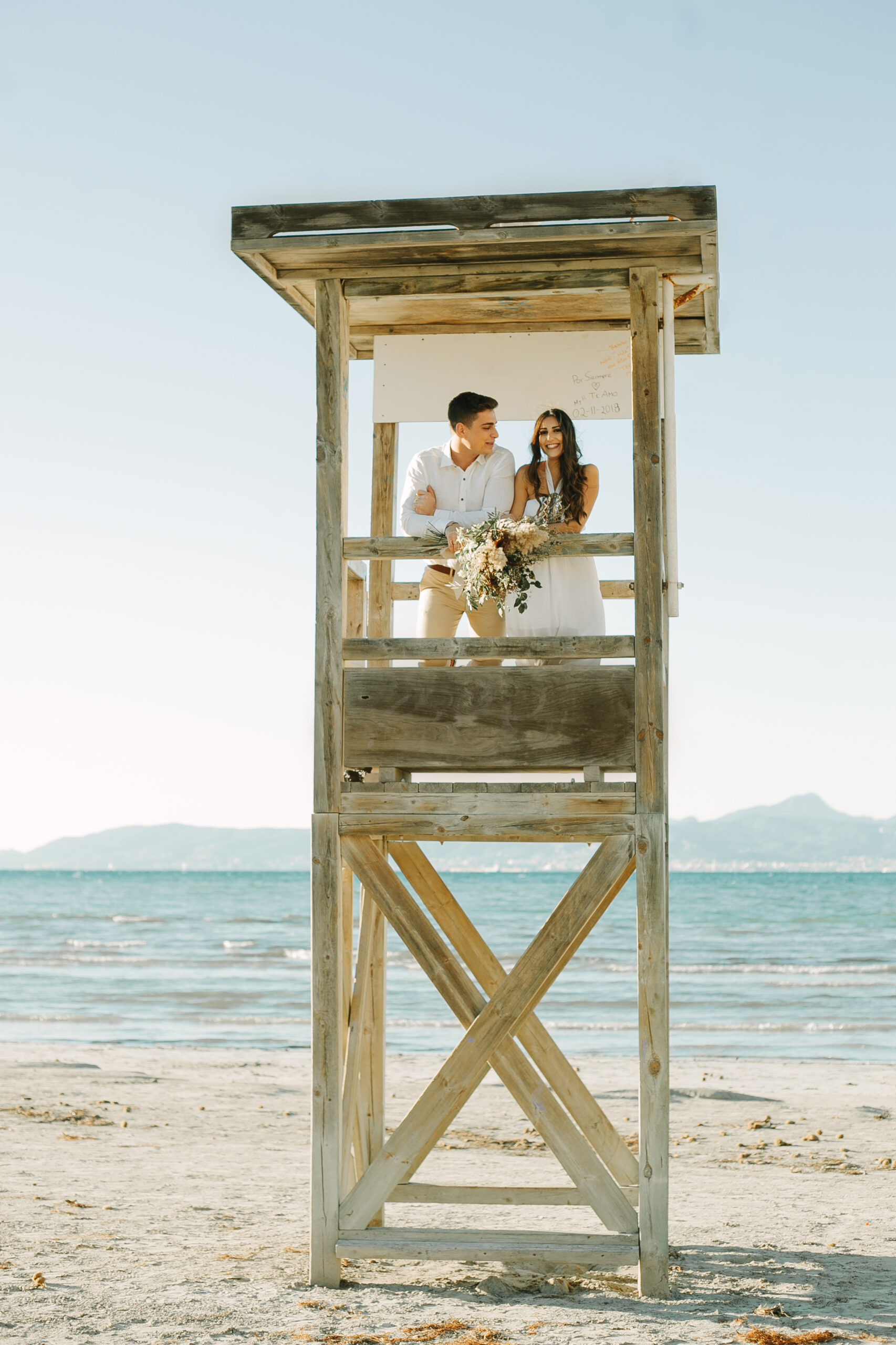 Engaged Couple in Beach Tower