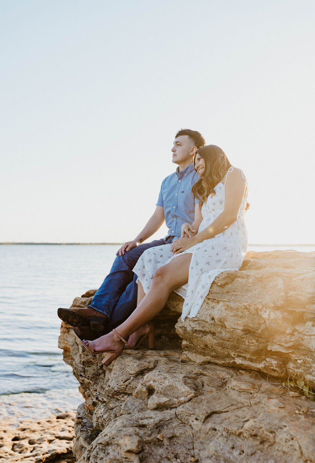 Engaged Couples Sitting On Rocks