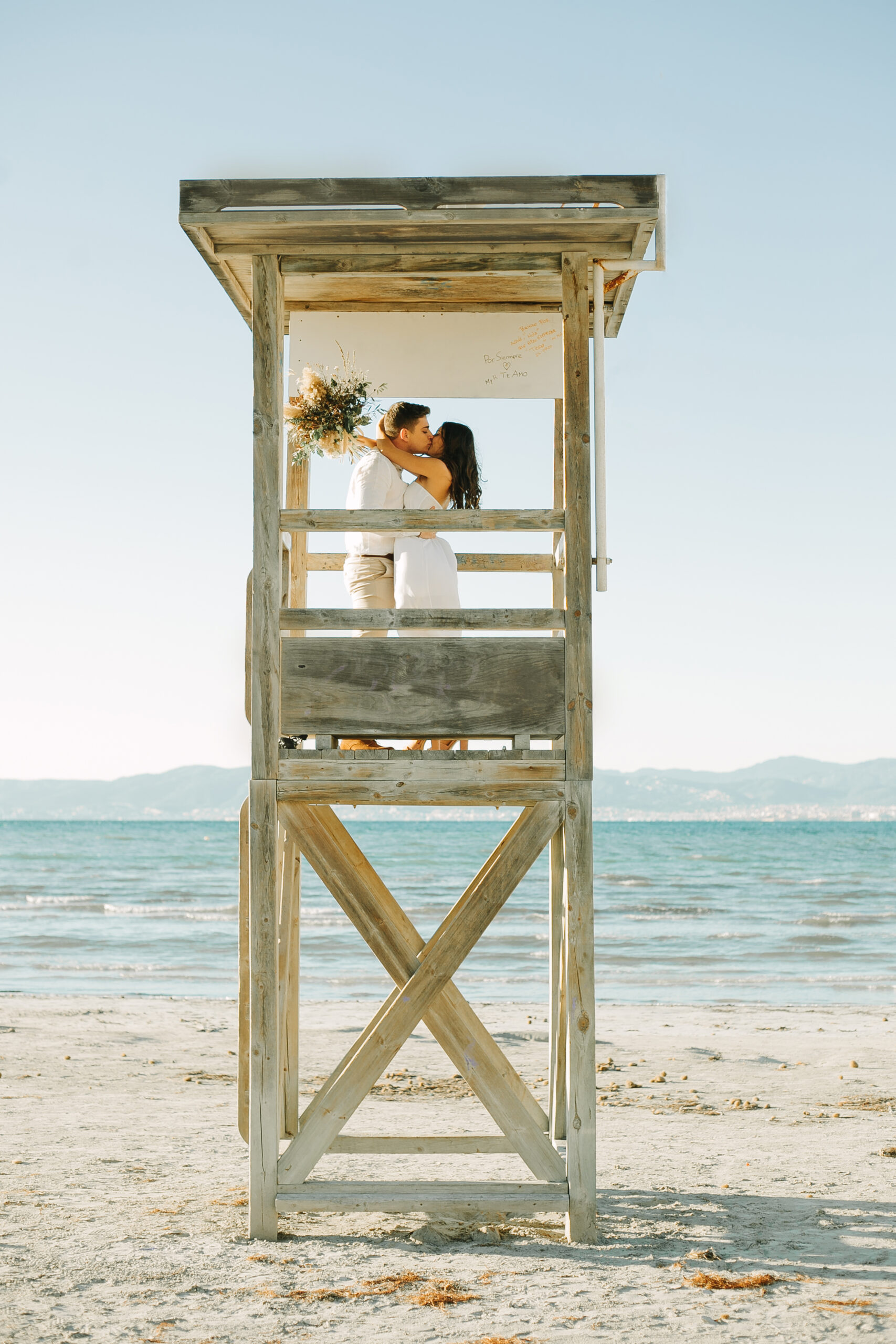 Engagement Beach Kiss in Tower