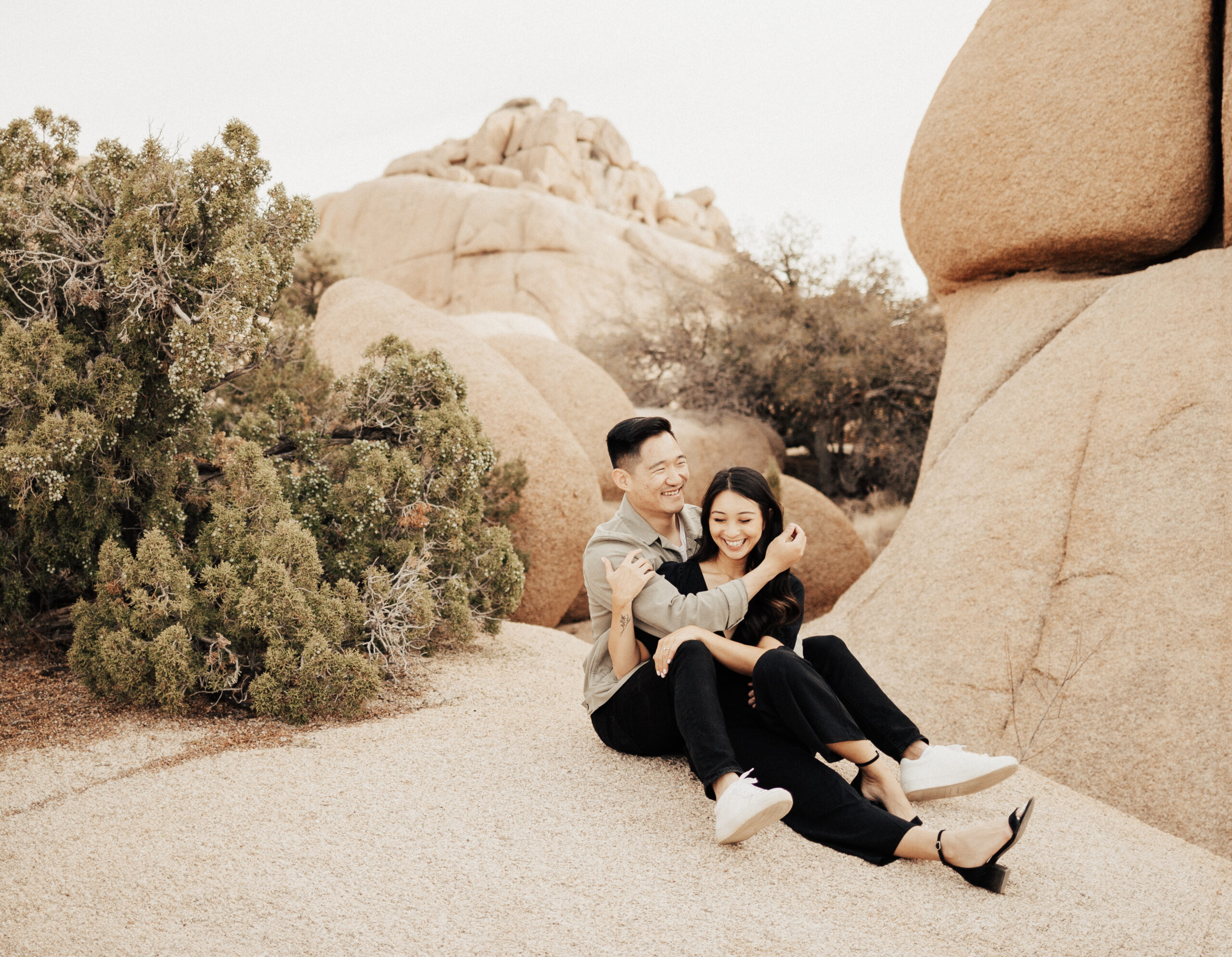 Engaged Couple Laugh on Rocks